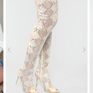 Thigh high snake print boots